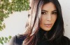 Kim Kardashian and Kanye West flying in what seems to be economy class